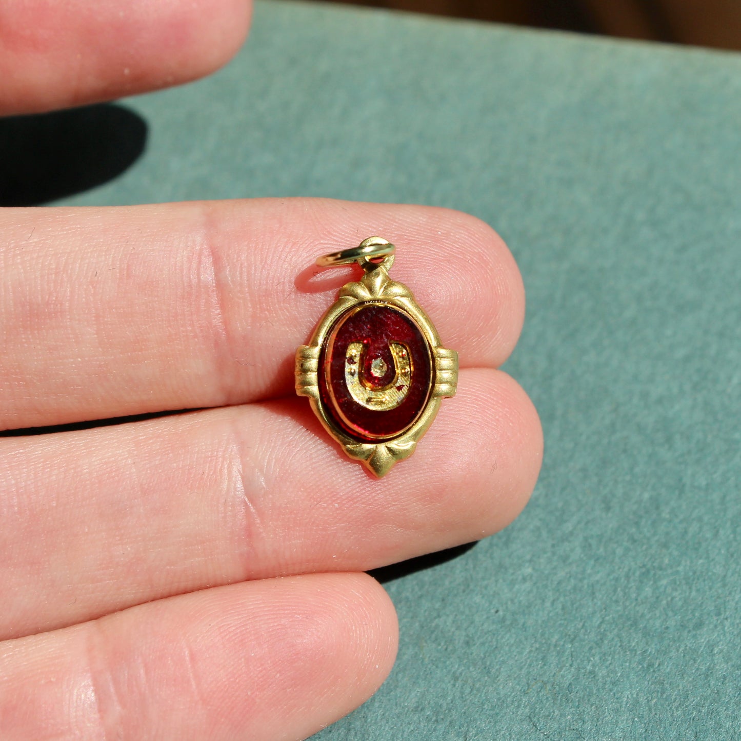1970s Carved Glass Red Horseshoe Charm