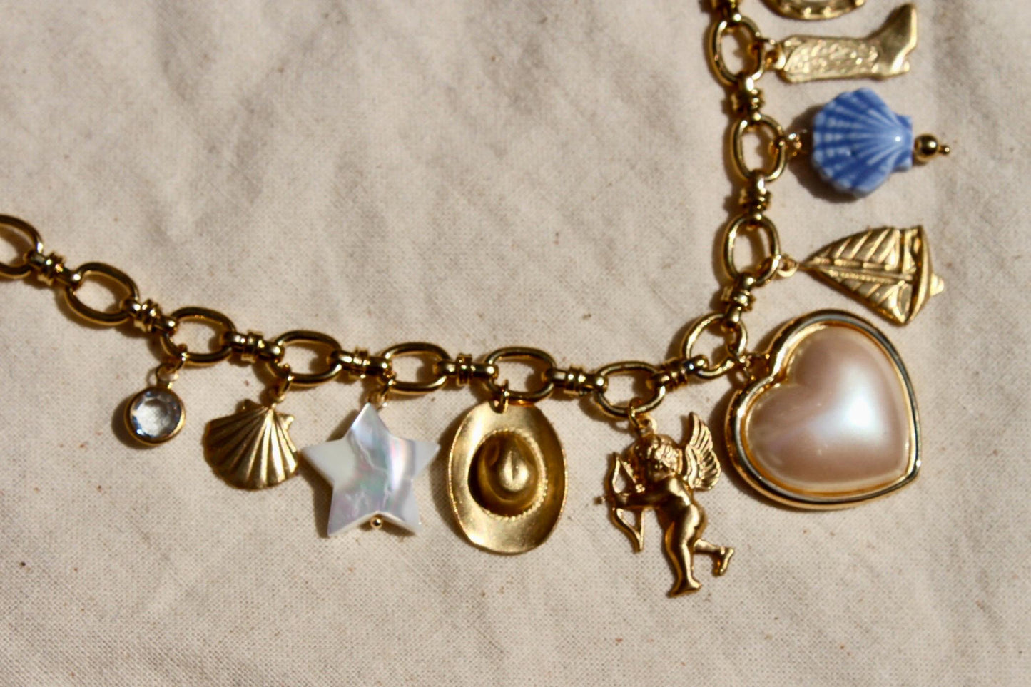 Vintage Coastal Cowgirl Charm Necklace - Western and Beach Themed Charm Necklace with Porcelain, Pearl, Brass, and Gold Plated Charms