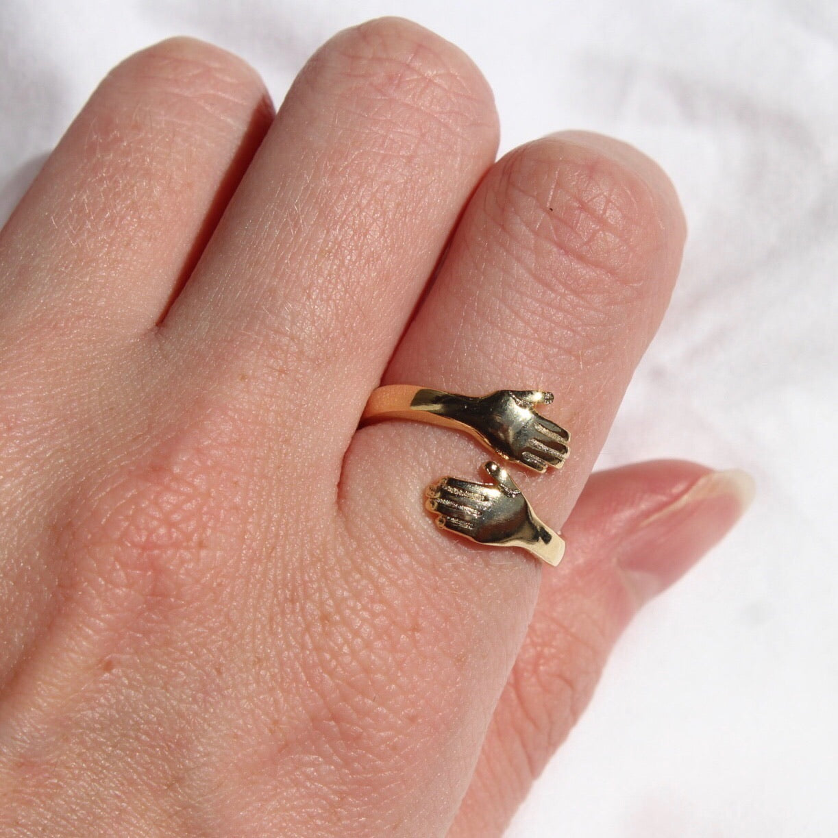 Gold Embracing Hands Ring